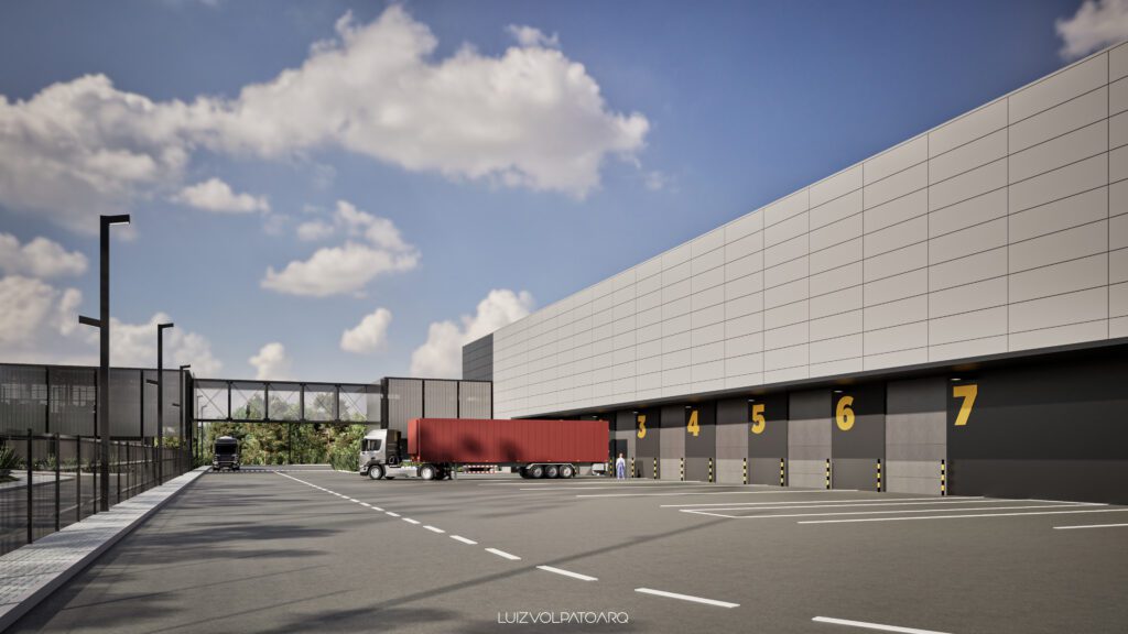 Exterior de um armazém moderno com docas de carga numeradas de 4 a 7, um contêiner vermelho sobre um caminhão branco na doca 5 e outro caminhão ao fundo. O céu está praticamente limpo, com algumas nuvens, e uma passarela para pedestres atravessa o terreno. - Luiz Volpato Arquitetura