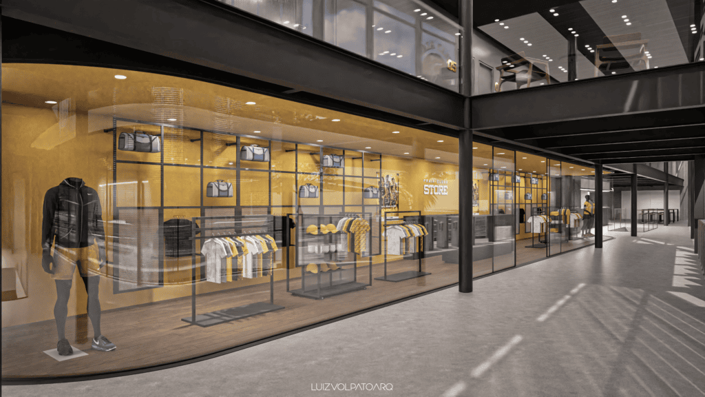 Uma loja com paredes de vidro exibe roupas, bolsas e acessórios com tema amarelo. Um manequim vestindo uma jaqueta está na entrada. Prateleiras e cabides ocupam todo o espaço. No alto, é possível ver um mezanino com mesas e cadeiras. O ambiente é bem iluminado e moderno. - Luiz Volpato Arquitetura